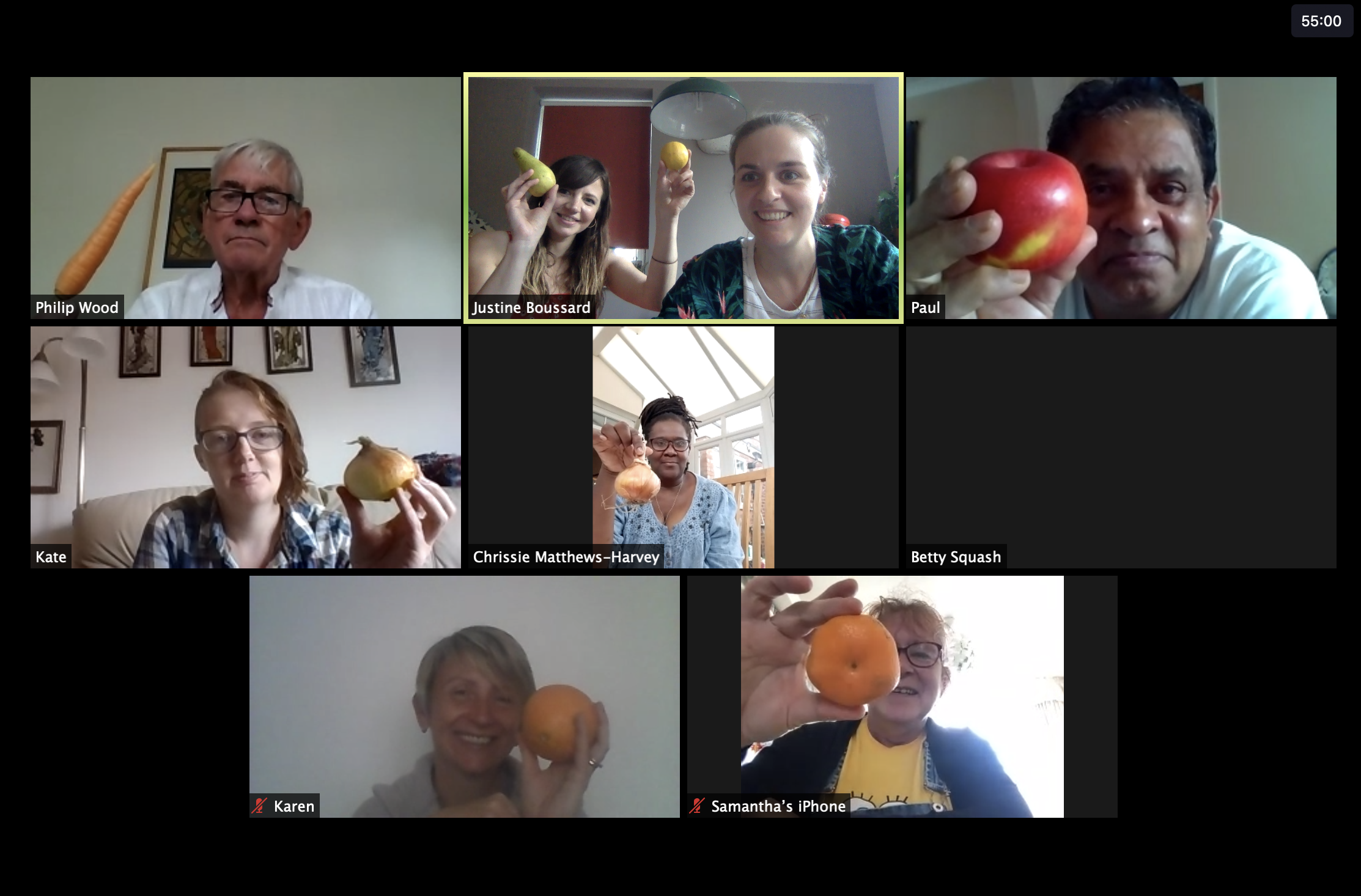 People on a video call holding fruit and vegetables