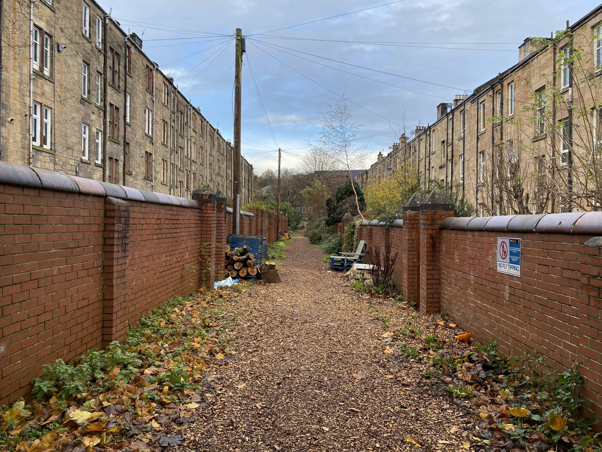 Pedestrian lane between tenement buildings.